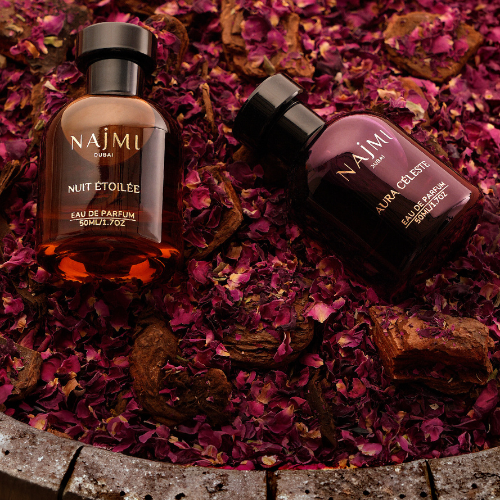 Elegant French perfume bottles with vintage labels, symbolizing the legacy of Grasse and modern craftsmanship by Parfums Najmi.