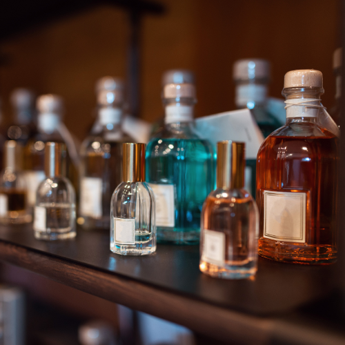 A luxurious Parfums Najmi perfume bottle displayed on a shelf, symbolizing elegance and long-lasting fragrance.